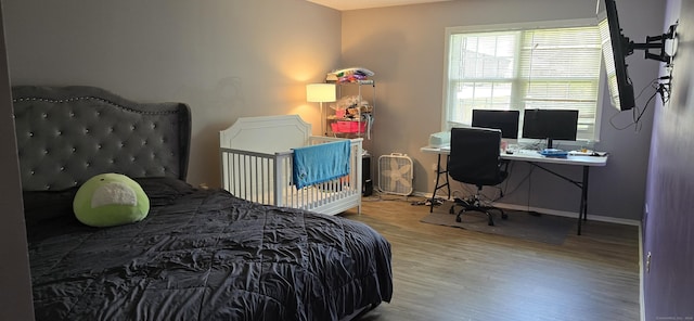 50 Greenhouse Rd Unit 41C, Bridgeport, CT 06606 - bedroom with wood finished floors, baseboards, and a desk