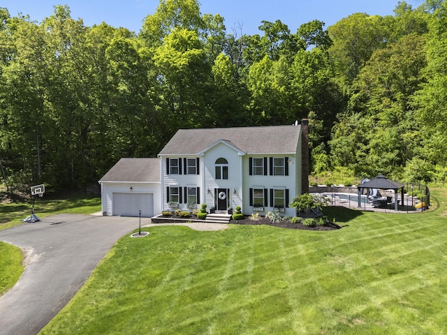 8 Autumn Ct, North Branford, CT 06472 - colonial home with a gazebo, a chimney, asphalt driveway, an attached garage, and a front lawn