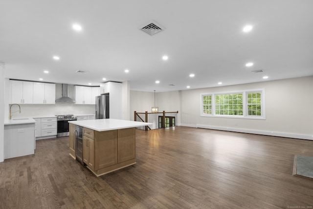 23 Aunt Pattys Ln W, Bethel, CT 06801 - kitchen featuring stainless steel appliances, wall chimney exhaust hood, a sink, dark wood-style floors, and beverage cooler