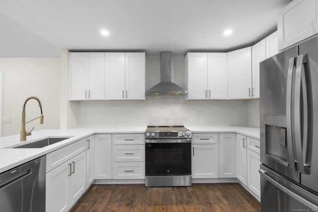 23 Aunt Pattys Ln W, Bethel, CT 06801 - kitchen with appliances with stainless steel finishes, wall chimney range hood, a sink, light countertops, and white cabinetry