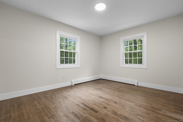 23 Aunt Pattys Ln W, Bethel, CT 06801 - empty room featuring healthy amount of natural light, wood finished floors, baseboards, and a baseboard radiator