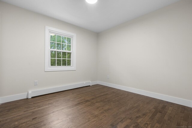 23 Aunt Pattys Ln W, Bethel, CT 06801 - empty room with a baseboard radiator, dark wood-type flooring, and baseboards