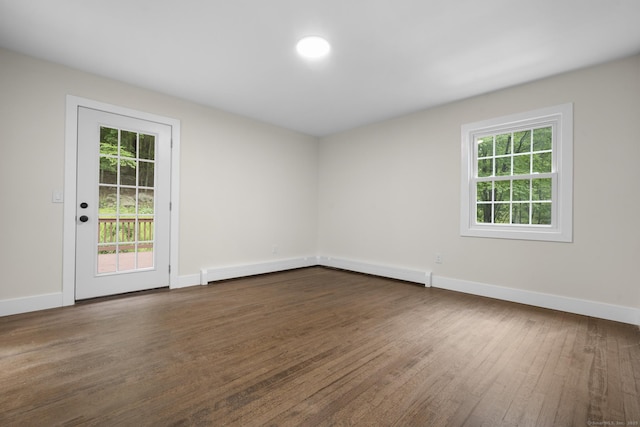 23 Aunt Pattys Ln W, Bethel, CT 06801 - spare room featuring plenty of natural light, dark wood-style flooring, and baseboards