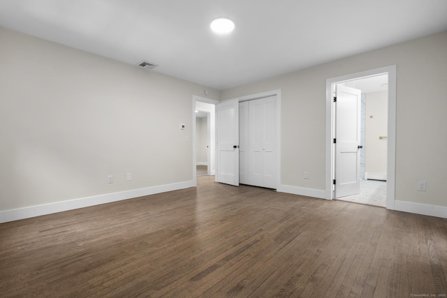 23 Aunt Pattys Ln W, Bethel, CT 06801 - unfurnished bedroom with wood finished floors, baseboards, and a closet