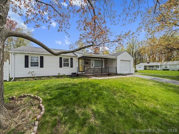 21 Poplar St, Enfield, CT 06082 - single story home featuring an attached garage, driveway, a front yard, and covered porch
