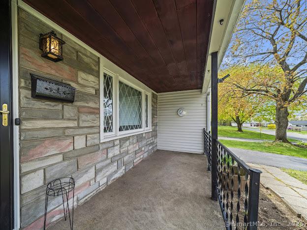 21 Poplar St, Enfield, CT 06082 - covered porch with a carport