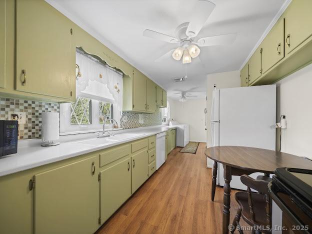 21 Poplar St, Enfield, CT 06082 - kitchen featuring ceiling fan, a sink, black appliances, tasteful backsplash, and light countertops