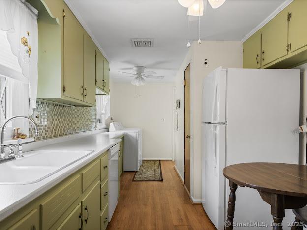 21 Poplar St, Enfield, CT 06082 - kitchen with a ceiling fan, white appliances, a sink, wood finished floors, and green cabinetry