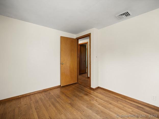21 Poplar St, Enfield, CT 06082 - empty room featuring baseboards and wood finished floors
