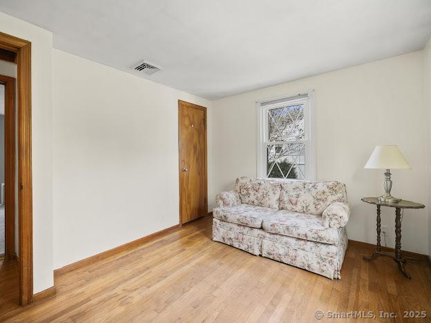 21 Poplar St, Enfield, CT 06082 - sitting room featuring wood finished floors
