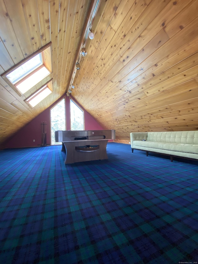21 Holiday Point Rd, Sherman, CT 06784 - additional living space with a skylight, carpet, vaulted ceiling, and wood walls