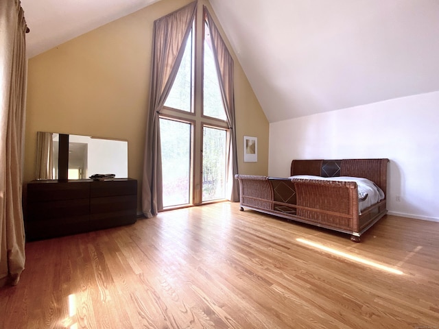 21 Holiday Point Rd, Sherman, CT 06784 - bedroom with high vaulted ceiling and wood finished floors