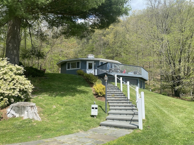 21 Holiday Point Rd, Sherman, CT 06784 - view of front facade featuring stairway, a front lawn, a wooden deck, and a view of trees