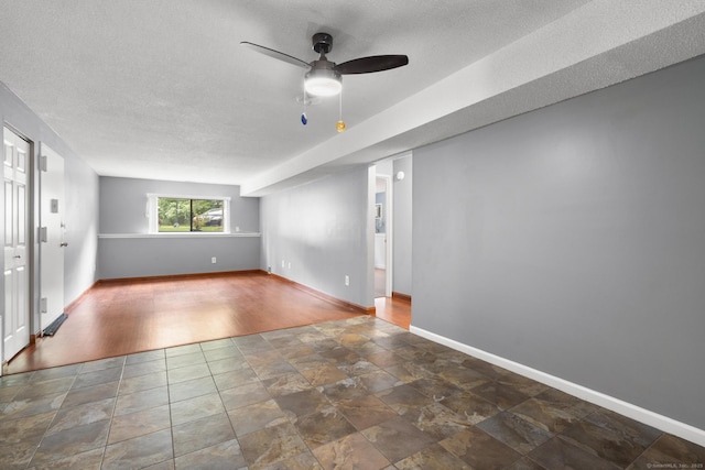 500 Darling St Unit 12M, Southington, CT 06489 - spare room featuring ceiling fan, a textured ceiling, baseboards, and wood finished floors