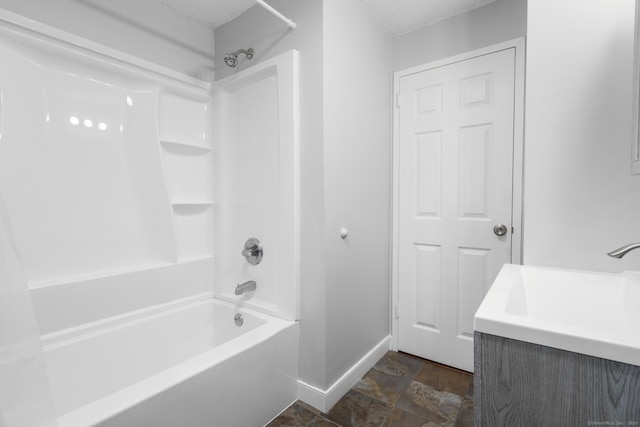 500 Darling St Unit 12M, Southington, CT 06489 - full bath featuring baseboards, shower / washtub combination, stone finish floors, and a textured ceiling