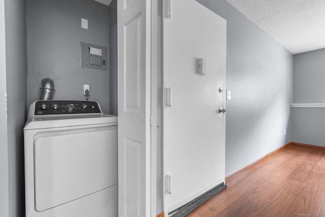 500 Darling St Unit 12M, Southington, CT 06489 - laundry room featuring washer / clothes dryer, wood finished floors, a textured ceiling, electric panel, and baseboards