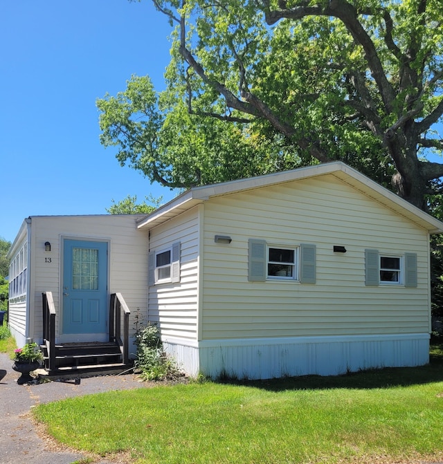 13 Green Acres Park Dr, Westbrook, CT 06498 - view of front facade with entry steps and a front lawn