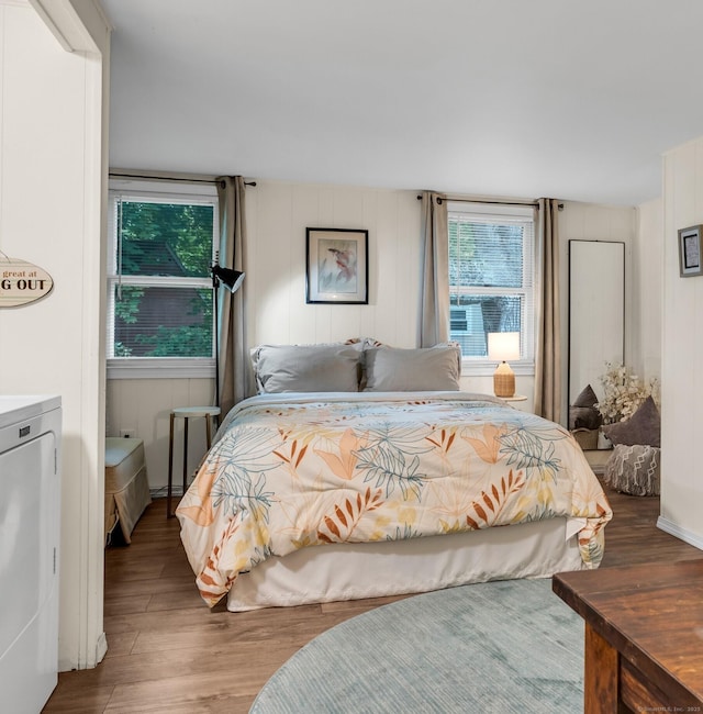 13 Green Acres Park Dr, Westbrook, CT 06498 - bedroom with wood finished floors and washing machine and dryer