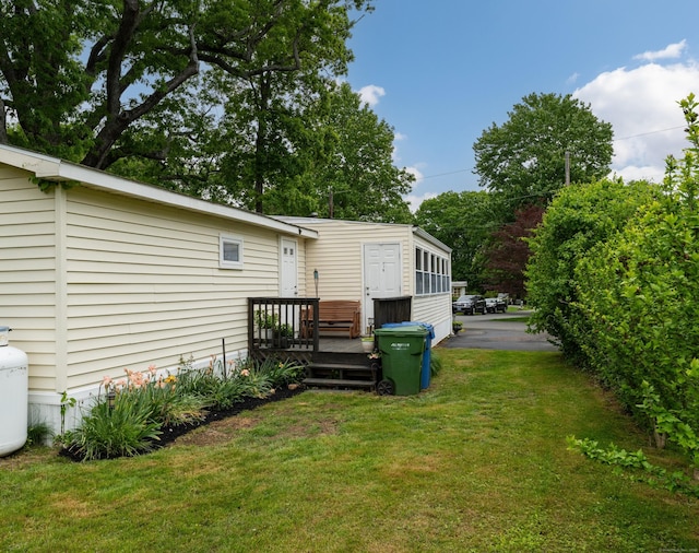 13 Green Acres Park Dr, Westbrook, CT 06498 - view of green lawn with a deck