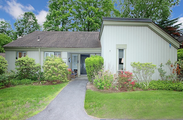 278 Heritage Vlg Unit B, Southbury, CT 06488 - view of front of property with a front yard, roof with shingles, and board and batten siding