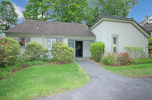 278 Heritage Vlg Unit B, Southbury, CT 06488 - view of front of property with a shingled roof and a front yard