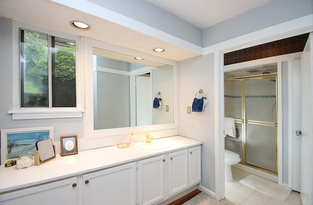 278 Heritage Vlg Unit B, Southbury, CT 06488 - bathroom with toilet, vanity, a shower stall, tile patterned flooring, and recessed lighting