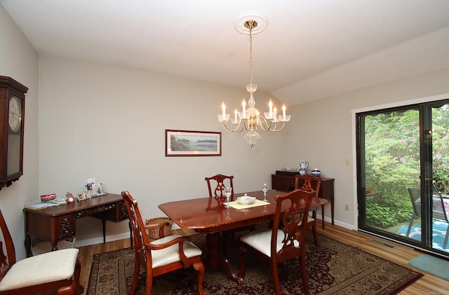 278 Heritage Vlg Unit B, Southbury, CT 06488 - dining room with wood finished floors, a chandelier, baseboards, and vaulted ceiling