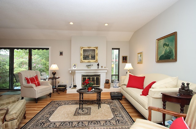 278 Heritage Vlg Unit B, Southbury, CT 06488 - living area with healthy amount of natural light, wood finished floors, recessed lighting, a brick fireplace, and vaulted ceiling