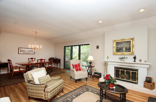 278 Heritage Vlg Unit B, Southbury, CT 06488 - living area with wood finished floors, a chandelier, recessed lighting, a brick fireplace, and baseboards