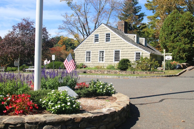 278 Heritage Vlg Unit B, Southbury, CT 06488 - view of home's exterior featuring a chimney