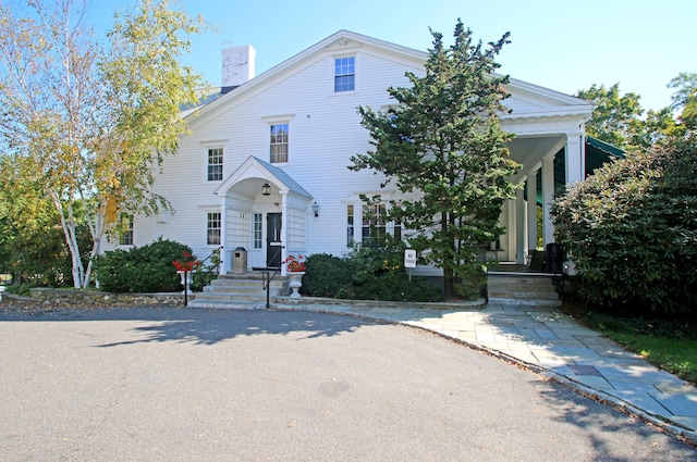278 Heritage Vlg Unit B, Southbury, CT 06488 - neoclassical home with a chimney