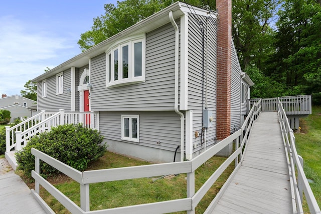 43 Worthington Rd, Glastonbury, CT 06033 - split foyer home with a chimney and a wooden deck