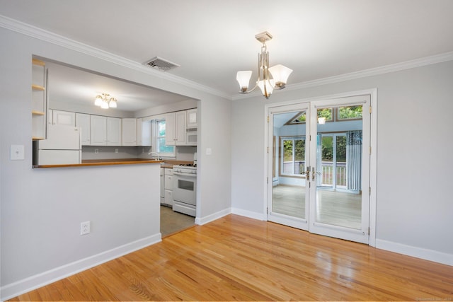 43 Worthington Rd, Glastonbury, CT 06033 - unfurnished dining area featuring a chandelier, light wood-style flooring, ornamental molding, baseboards, and french doors