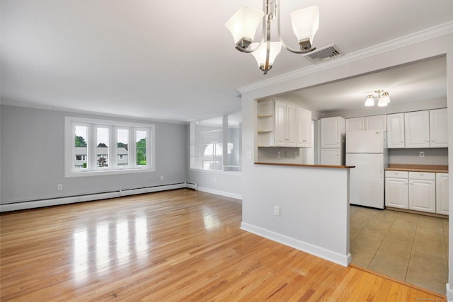 43 Worthington Rd, Glastonbury, CT 06033 - kitchen featuring freestanding refrigerator, a baseboard heating unit, white cabinets, ornamental molding, and a chandelier
