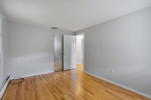 43 Worthington Rd, Glastonbury, CT 06033 - unfurnished bedroom featuring baseboard heating, light wood finished floors, and baseboards