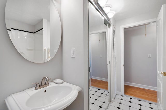 43 Worthington Rd, Glastonbury, CT 06033 - bathroom with tile patterned floors, a sink, and baseboards