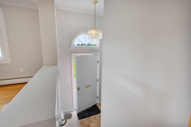 43 Worthington Rd, Glastonbury, CT 06033 - entrance foyer featuring a chandelier, a baseboard radiator, ornamental molding, and baseboards