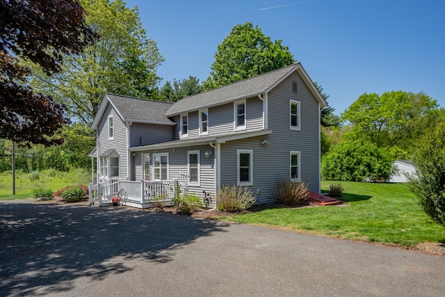 113 E Rd, East Windsor, CT 06016 - view of front of home featuring a front yard, roof with shingles, asphalt driveway, and a wooden deck
