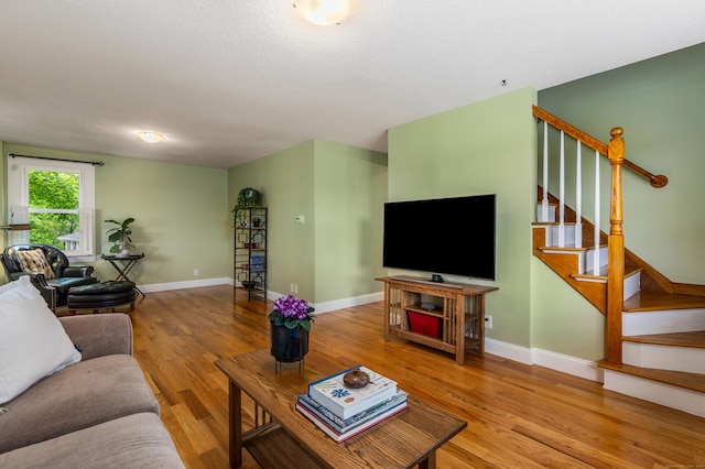 113 E Rd, East Windsor, CT 06016 - living area with wood finished floors, stairs, and baseboards