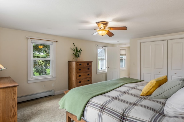 113 E Rd, East Windsor, CT 06016 - bedroom with baseboard heating, multiple windows, light carpet, and a closet