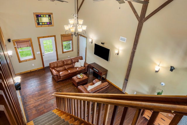 113 E Rd, East Windsor, CT 06016 - living area with a high ceiling, hardwood / wood-style floors, baseboards, a ceiling fan, and a chandelier