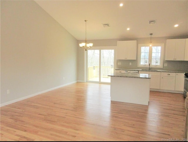 148 Gallup Hill Rd, Ledyard, CT 06339 - kitchen with a sink, light wood-type flooring, a chandelier, a kitchen island, and white cabinets