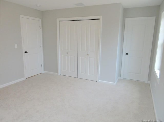 148 Gallup Hill Rd, Ledyard, CT 06339 - unfurnished bedroom featuring carpet, a closet, and baseboards