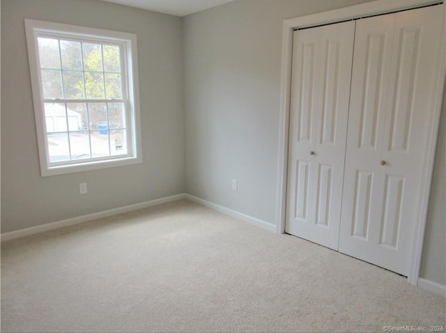 148 Gallup Hill Rd, Ledyard, CT 06339 - unfurnished bedroom with carpet floors, a closet, and baseboards