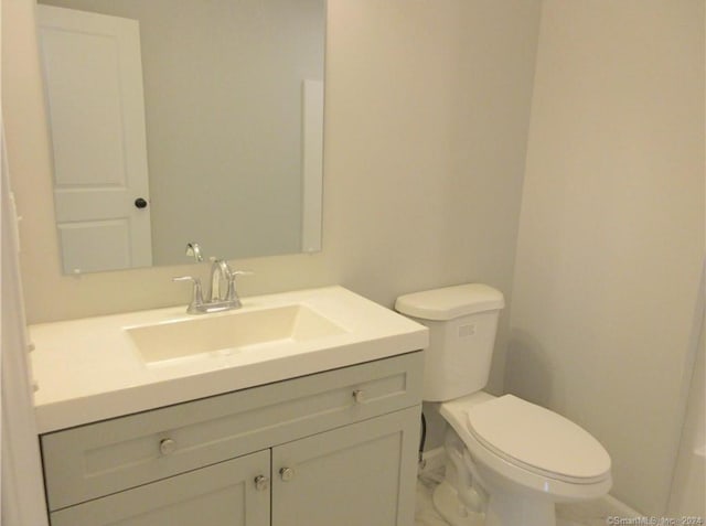 148 Gallup Hill Rd, Ledyard, CT 06339 - half bathroom featuring baseboards, toilet, and vanity