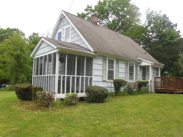 85 Blackberry Hill Rd, Beacon Falls, CT 06403 - view of front of property featuring a sunroom, a shingled roof, a chimney, a wooden deck, and a front lawn
