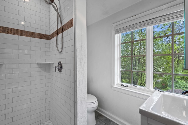 128 Blake Rd, Hamden, CT 06517 - full bath featuring a stall shower, healthy amount of natural light, toilet, and baseboards