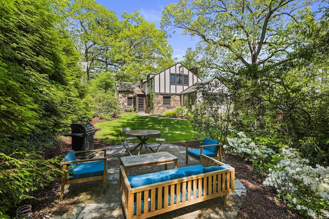 128 Blake Rd, Hamden, CT 06517 - view of green lawn with a patio area and outdoor lounge area