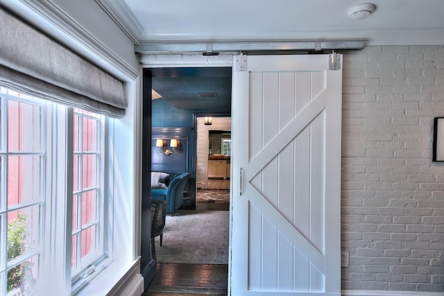 4 Plumtree Ln, Westport, CT 06880 - corridor featuring a barn door, dark wood finished floors, and crown molding