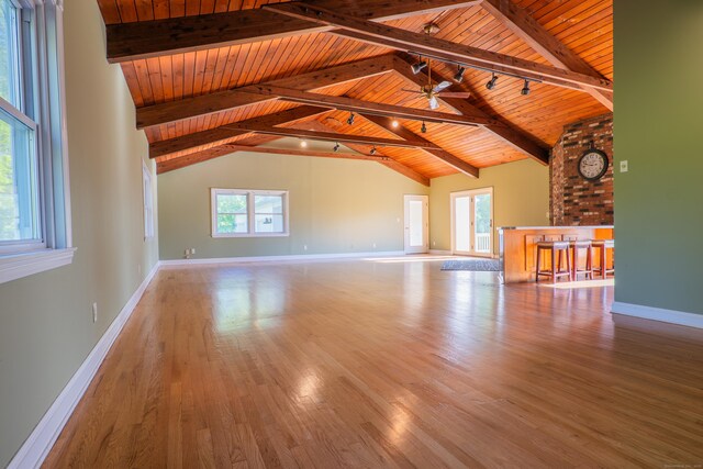 125 Woodchuck Ln, Harwinton, CT 06791 - unfurnished living room with wooden ceiling with exposed beams, wood finished floors, baseboards, a ceiling fan, and high vaulted ceiling